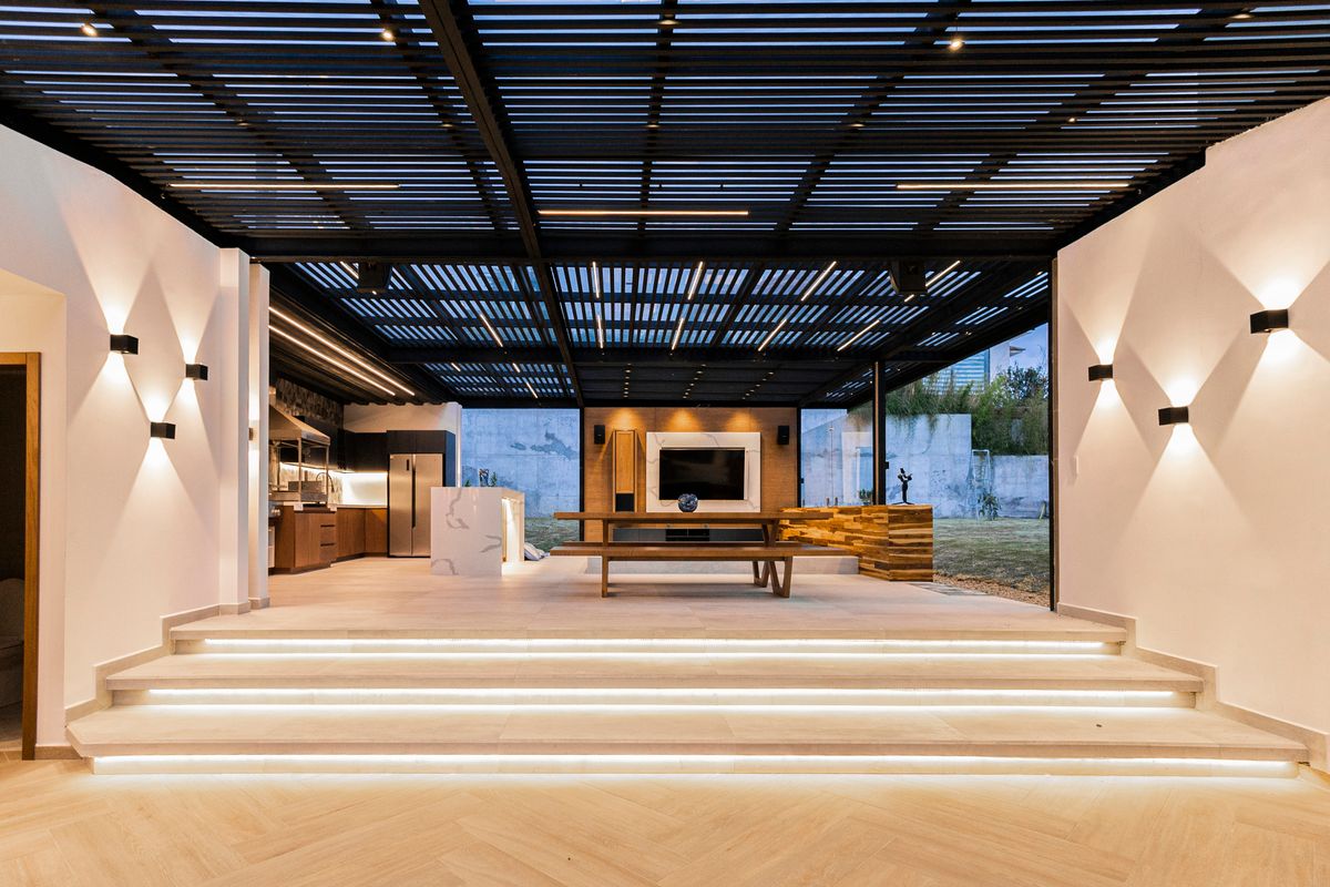 Open plan villa living space opening onto the terrace
